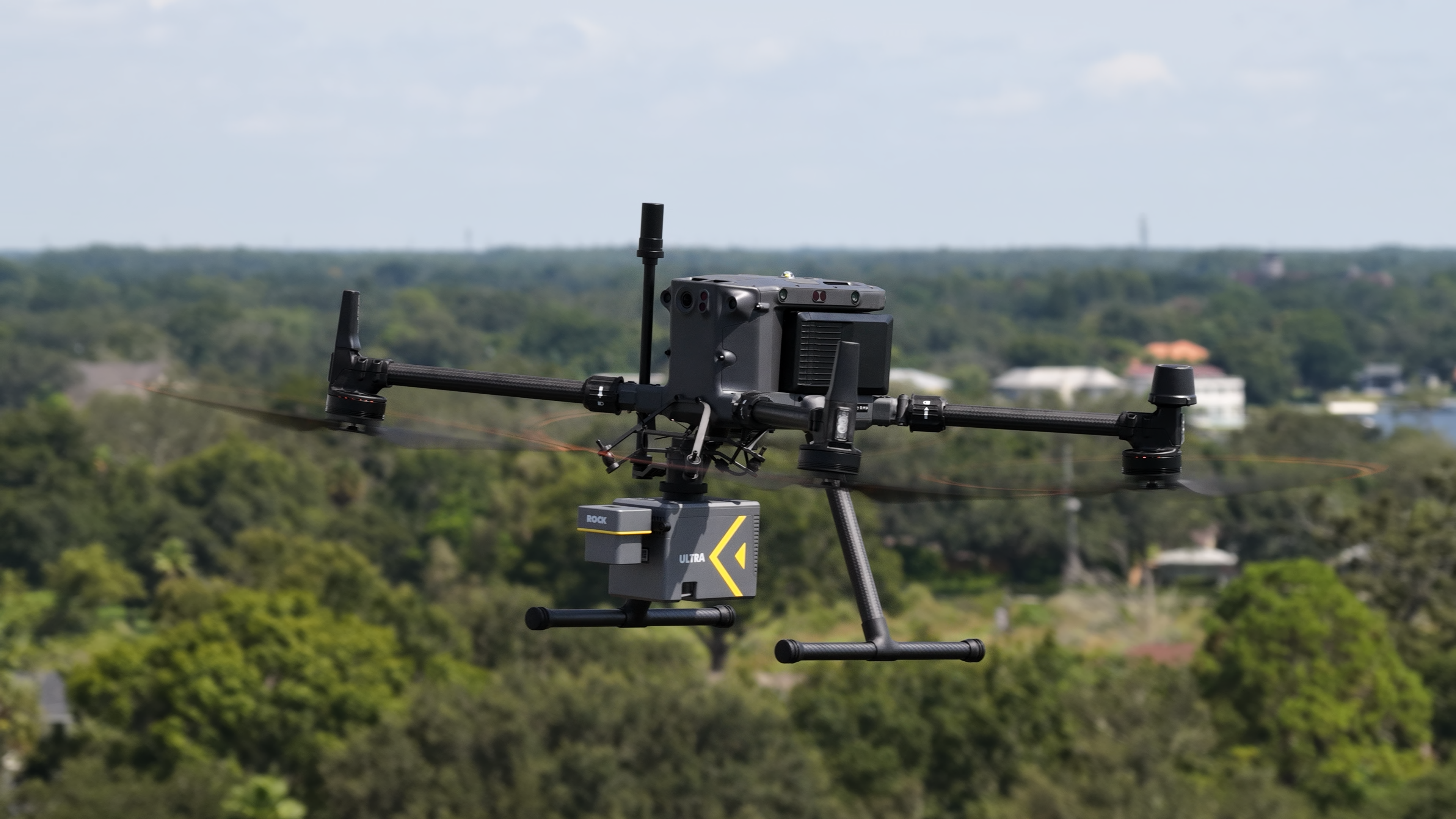 ROCK Ultra LiDAR mounted on a DJI M350 drone flying over a highway interchange for a case study with Dylan Gorman.